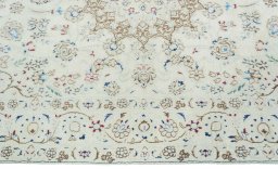 Corner detail of 2000s Nain rug showing border pattern and Wool pile