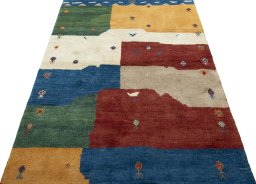 Surface texture of 2000s Persian Gabbeh rug with natural Wool and intricate pattern