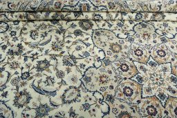 Close-up detail of 2000s Kashan rug from Iran / Persia showing Wool weave