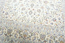 Close-up detail of 2000s Kashan rug from Iran / Persia showing Wool weave