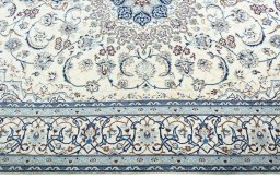 Corner detail of New Nain rug showing border pattern and Wool pile