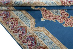Close-up detail of 2000s Kerman rug from Iran / Persia showing Wool weave