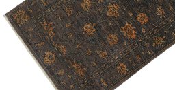 Backside of handmade New Farahan rug showing knot structure and weave density