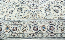 Corner detail of 2000s Nain rug showing border pattern and Wool pile