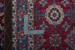 Close-up detail of 2000s Mashad rug from Iran / Persia showing Wool weave