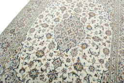 Backside of handmade 2000s Kashan rug showing knot structure and weave density