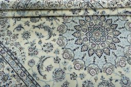 Close-up detail of 2000s Nain rug from Iran / Persia showing Wool weave