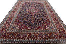 Surface texture of 2000s Kashan rug with natural Wool and intricate pattern