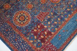 Backside of handmade New Mamluk rug showing knot structure and weave density