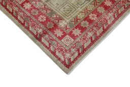 Backside of handmade 1950s Antique Carpets rug showing knot structure and weave density