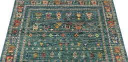 Backside of handmade New Samarkand rug showing knot structure and weave density