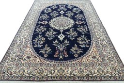 Surface texture of 2000s Nain rug with natural Wool and intricate pattern