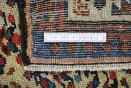 Corner detail of 1900s Antique Carpets rug showing border pattern and Wool pile