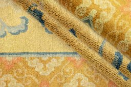 Corner detail of 1920s Antique Carpets rug showing border pattern and Wool pile
