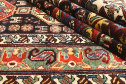 Close-up detail of 1900s Antique Carpets rug from Iran / Persia showing Wool weave