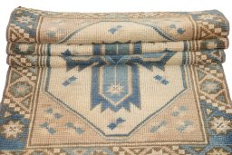 Corner detail of 1920s Antique Carpets rug showing border pattern and Wool pile