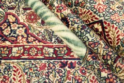Close-up detail of 1900s Antique Carpets rug from Iran / Persia showing Wool weave