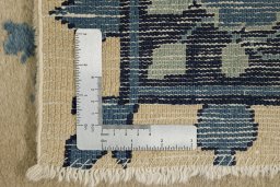 Close-up detail of 1900s Antique Carpets rug from China showing Wool weave