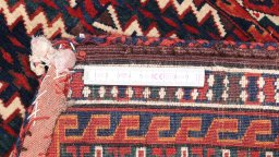 Close-up detail of 1920s Antique Carpets rug from Uzbekistan showing Wool weave