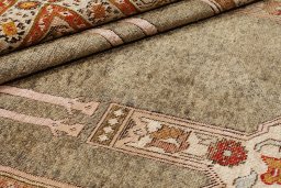 Corner detail of 1900s Antique Carpets rug showing border pattern and Silk pile