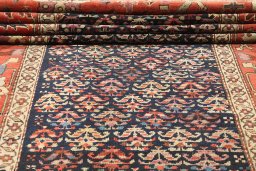 Close-up detail of 1880s Antique Carpets rug from Iran / Persia showing Wool weave