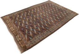 Close-up detail of 1900s Antique Carpets rug from Uzbekistan showing Wool weave
