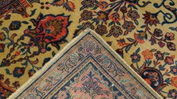 Corner detail of 1920s Antique Carpets rug showing border pattern and Wool pile