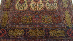Central medallion detail of 1920s Antique Carpets rug from Iran / Persia
