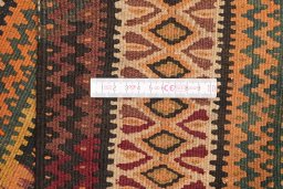 Full view of 1920s Kilim Antique rug from Iran / Persia, 419 × 109 cm in Brown tones