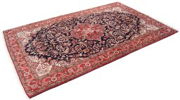 Corner detail of 1950s Semi-antique Carpets rug showing border pattern and Wool pile