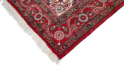 Backside of handmade 1950s Semi-antique Carpets rug showing knot structure and weave density