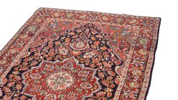Surface texture of 1950s Semi-antique Carpets rug with natural Wool and intricate pattern