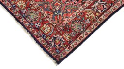 Backside of handmade 1950s Semi-antique Carpets rug showing knot structure and weave density