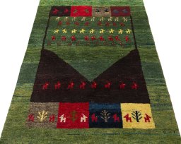 Surface texture of 2000s Persian Gabbeh rug with natural Wool and intricate pattern