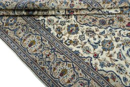Close-up detail of 2000s Kashan rug from Iran / Persia showing Wool weave