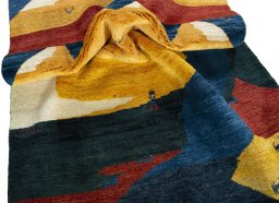Corner detail of 2000s Persian Gabbeh rug showing border pattern and Wool pile