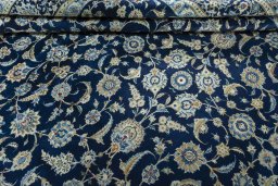 Close-up detail of 2000s Kashan rug from Iran / Persia showing Wool weave