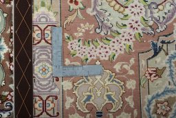 Backside of handmade New Tabriz 50/60/70 Raj rug showing knot structure and weave density