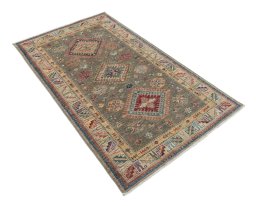Corner detail of New Kazak rug showing border pattern and Wool pile