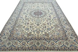 Surface texture of 2000s Nain rug with natural Wool and intricate pattern