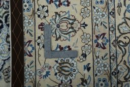 Backside of handmade 2000s Nain rug showing knot structure and weave density