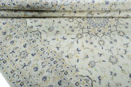 Corner detail of 2000s Kashan rug showing border pattern and Wool pile