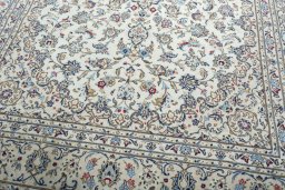Close-up detail of 2000s Kashan rug from Iran / Persia showing Wool weave