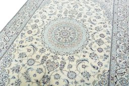 Backside of handmade 2000s Nain rug showing knot structure and weave density