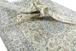 Surface texture of 2000s Nain rug with natural Wool and intricate pattern