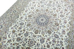 Backside of handmade 2000s Kashan rug showing knot structure and weave density