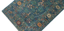 Backside of handmade New Farahan rug showing knot structure and weave density