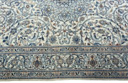 Corner detail of 2000s Kashmar rug showing border pattern and Wool pile