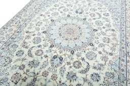 Backside of handmade New Nain rug showing knot structure and weave density