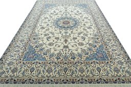 Surface texture of 2000s Nain rug with natural Wool and intricate pattern